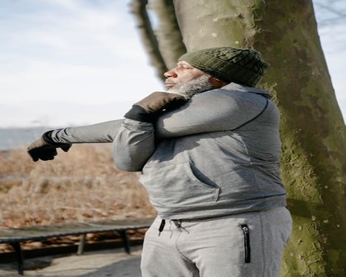 Man stretching outdoors morning light
